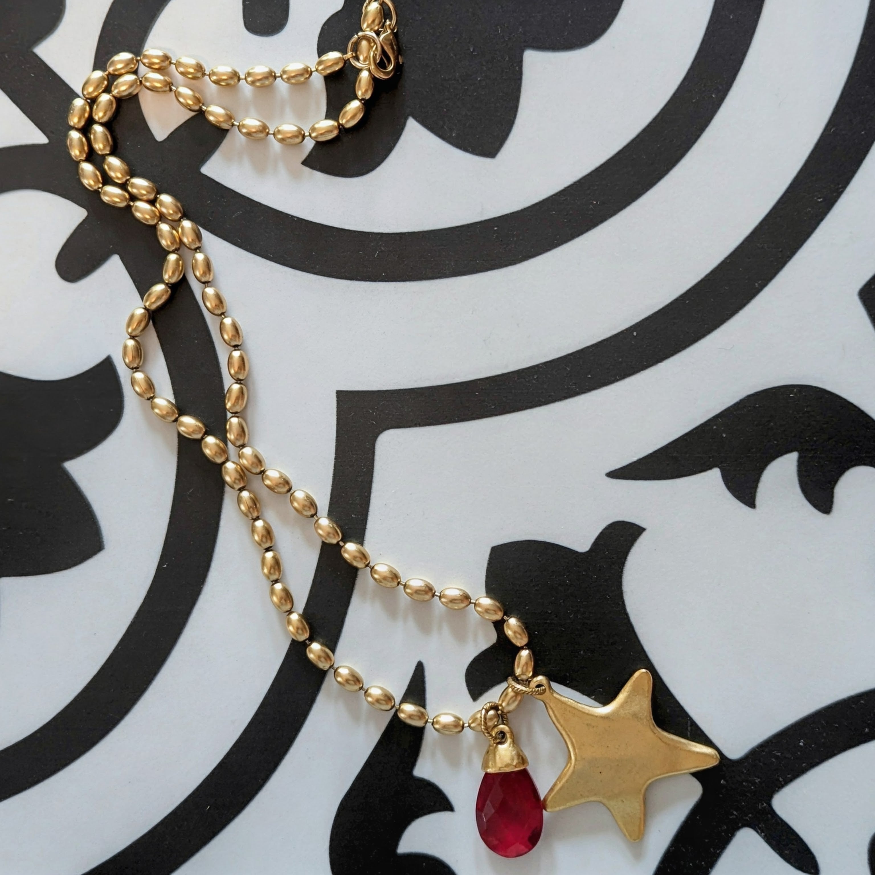 Star charm with red pendant necklace