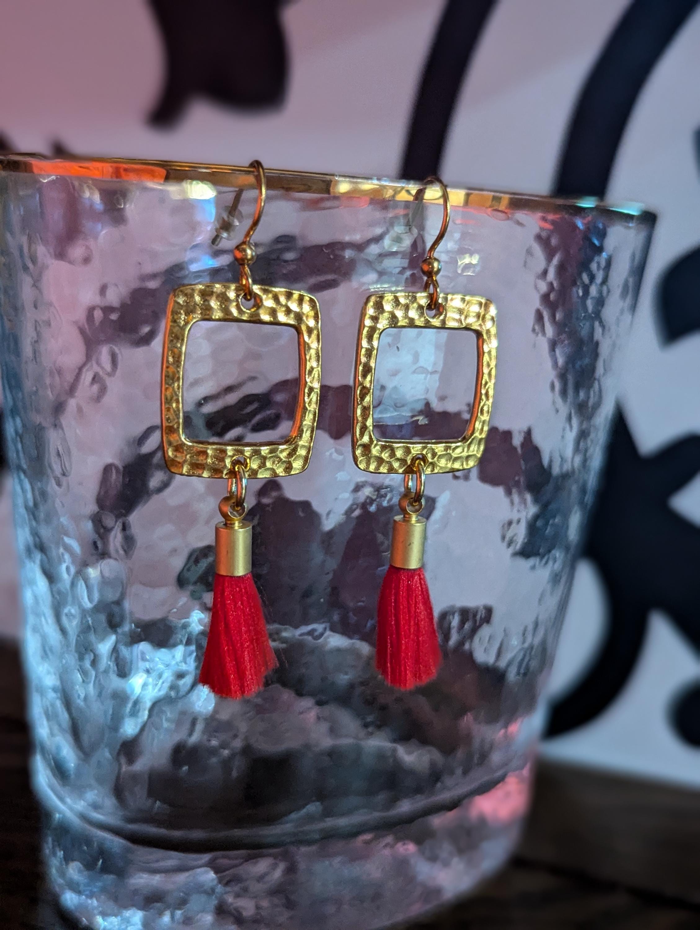 Gold Square drop earrings with red tassel.
