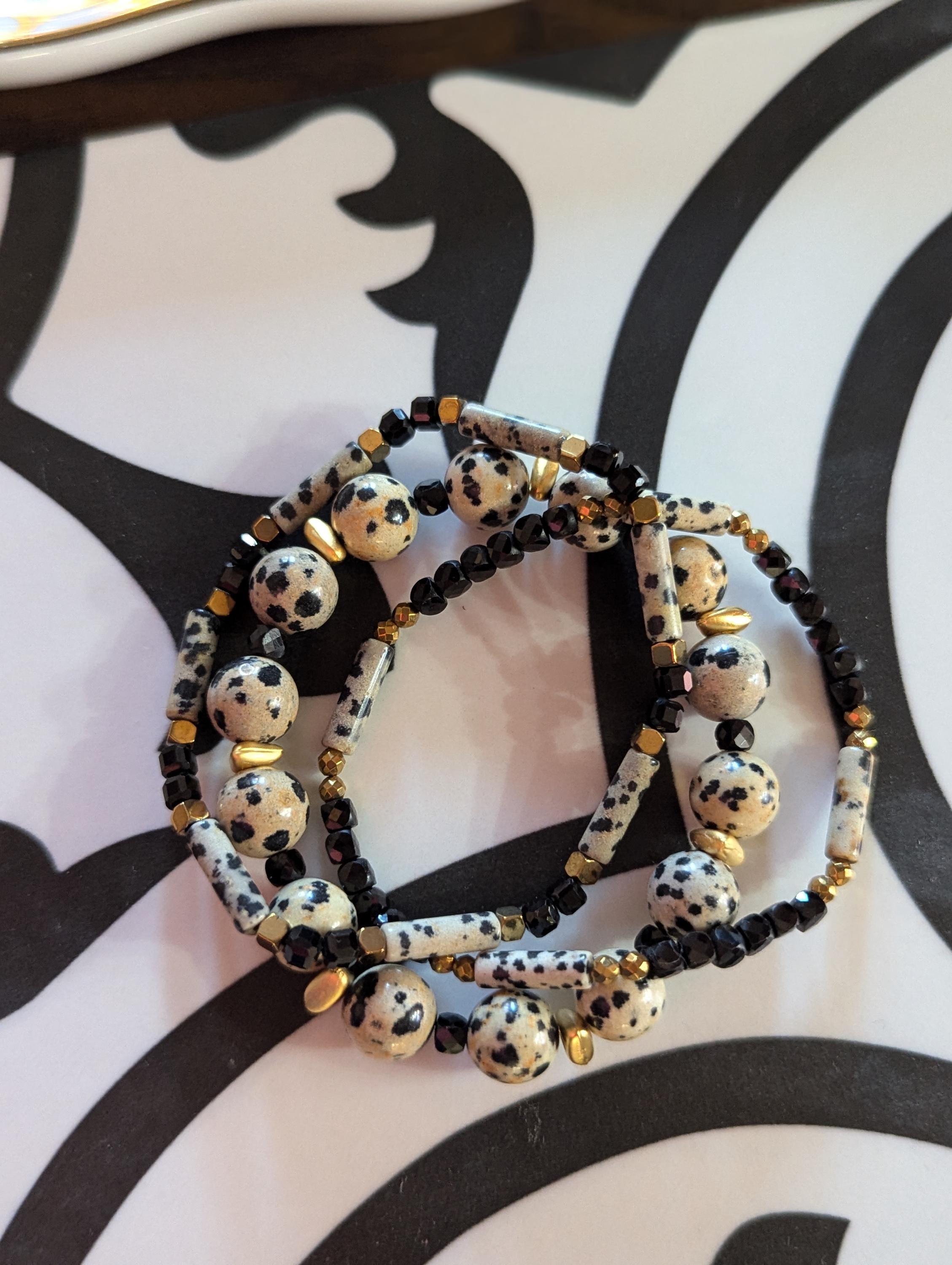 Dalmatian Jasper stretch bracelet with Gold accents and black spinel