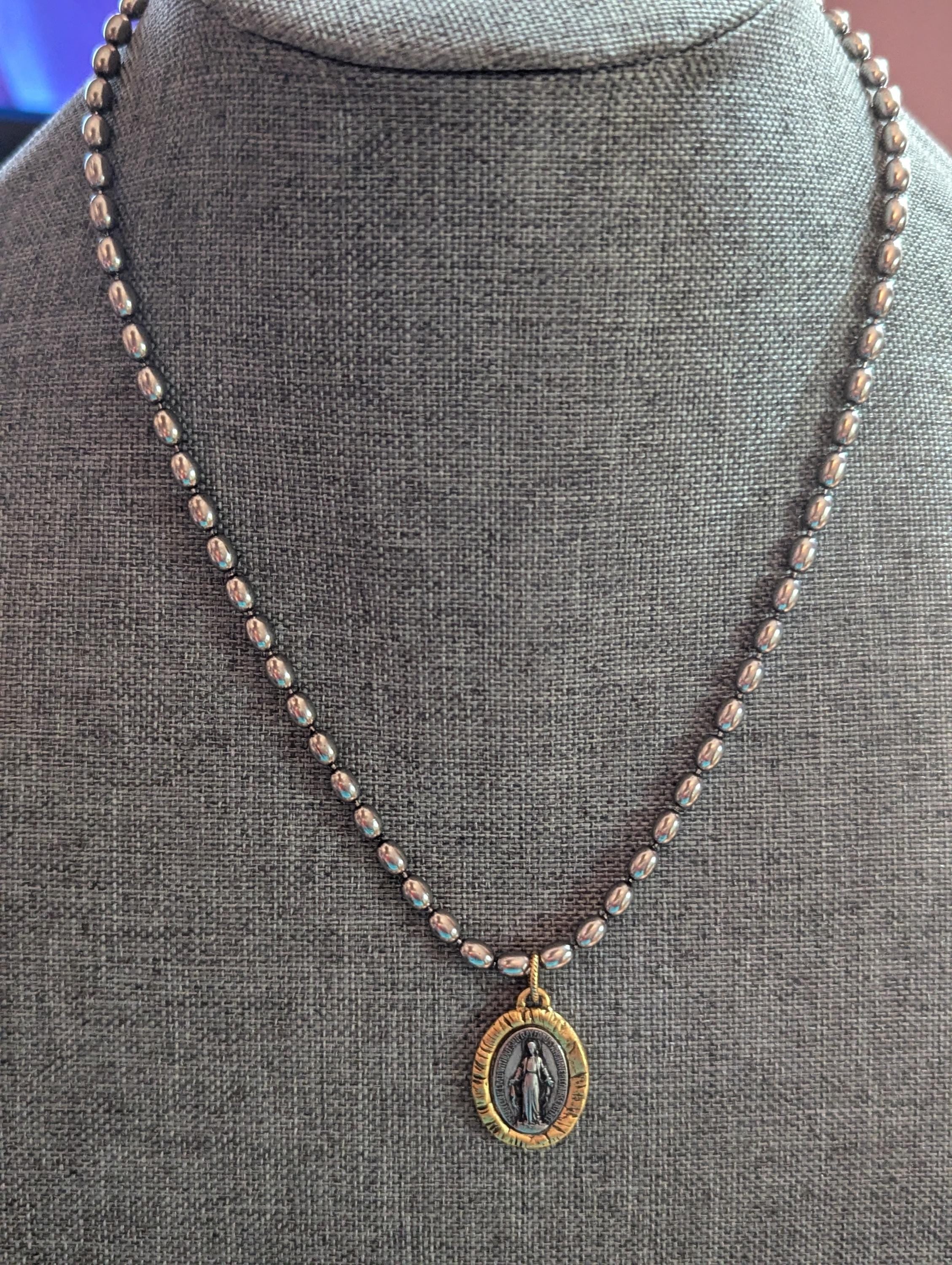 Silver chain with two tone Mary Medal with prayer.