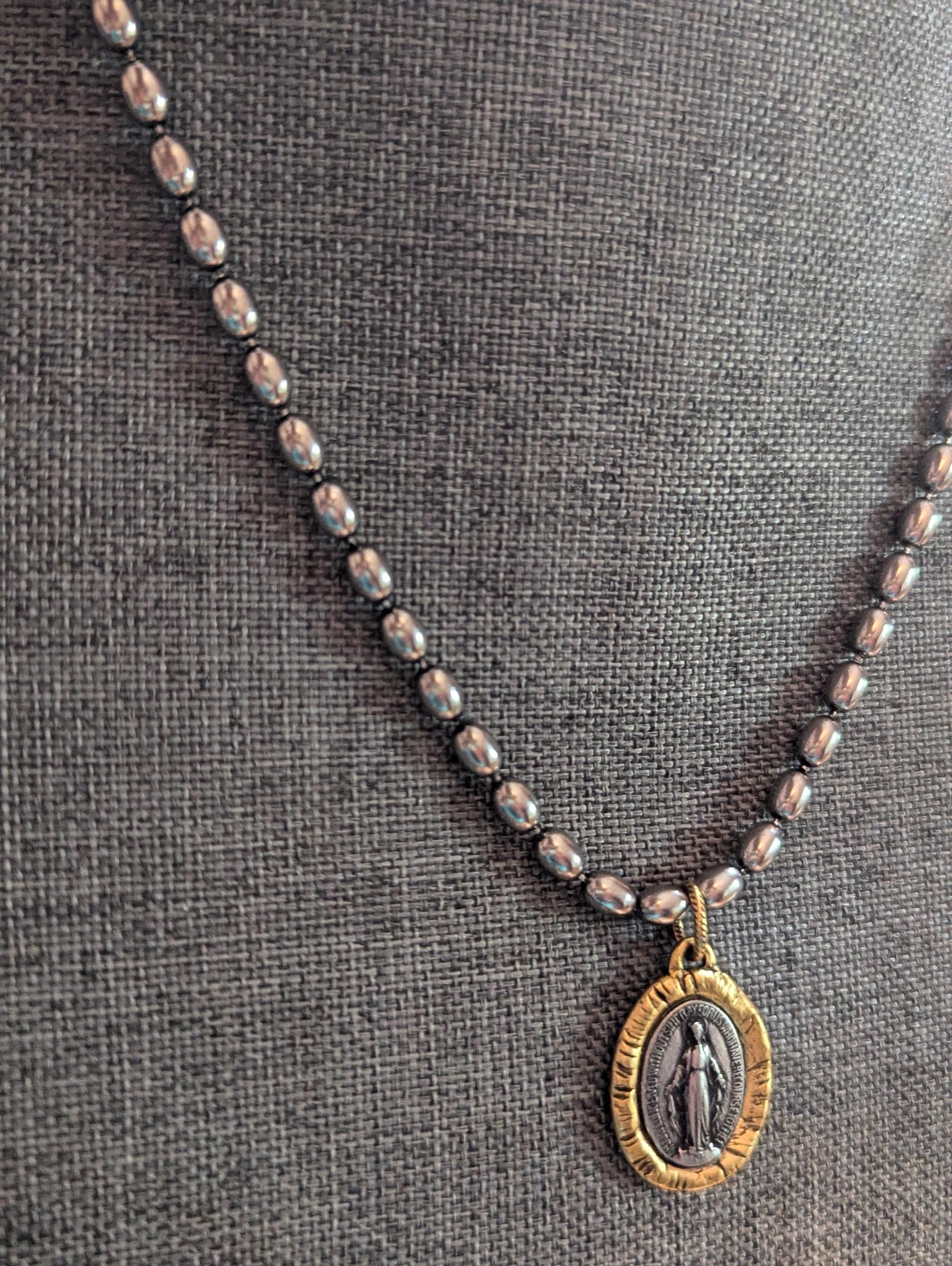 Silver chain with two tone Mary Medal with prayer.