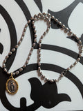 Silver chain with two tone Mary Medal with prayer.