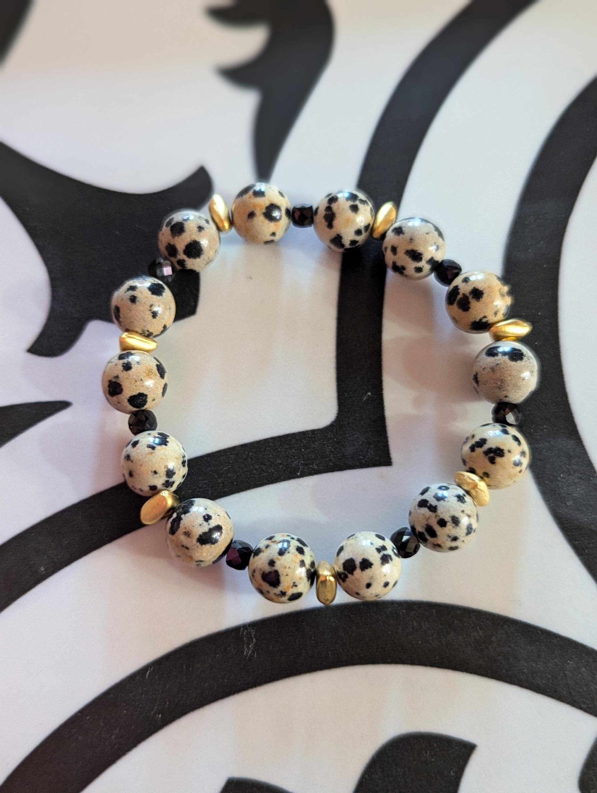 Dalmatian Jasper stretch bracelet with Gold accents and black spinel