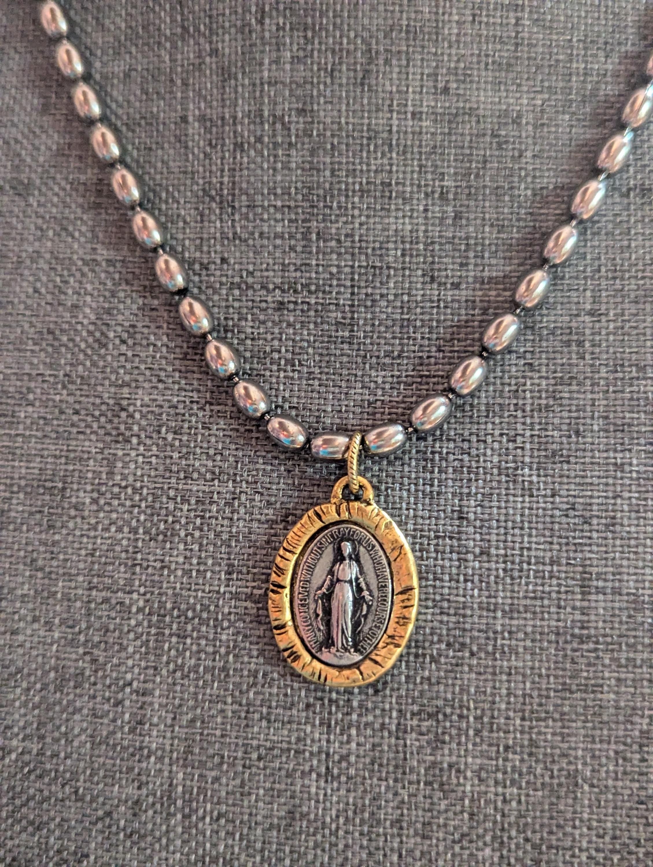Silver chain with two tone Mary Medal with prayer.